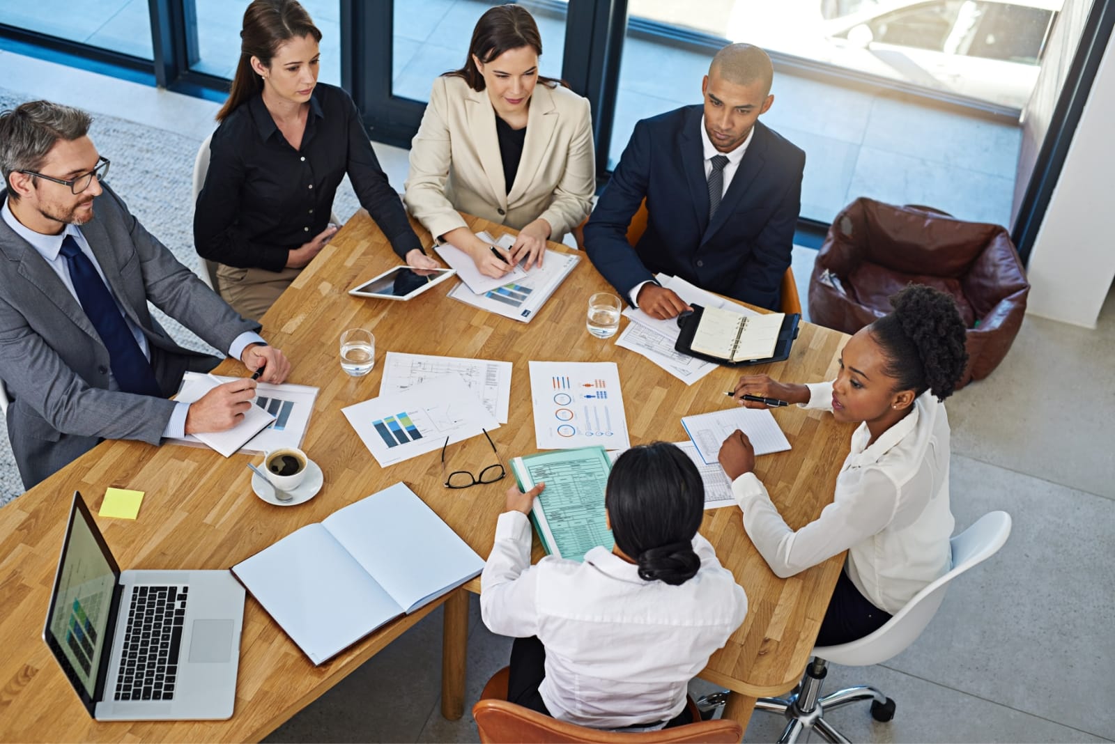 Advisor presenting monthly goals on a tablet